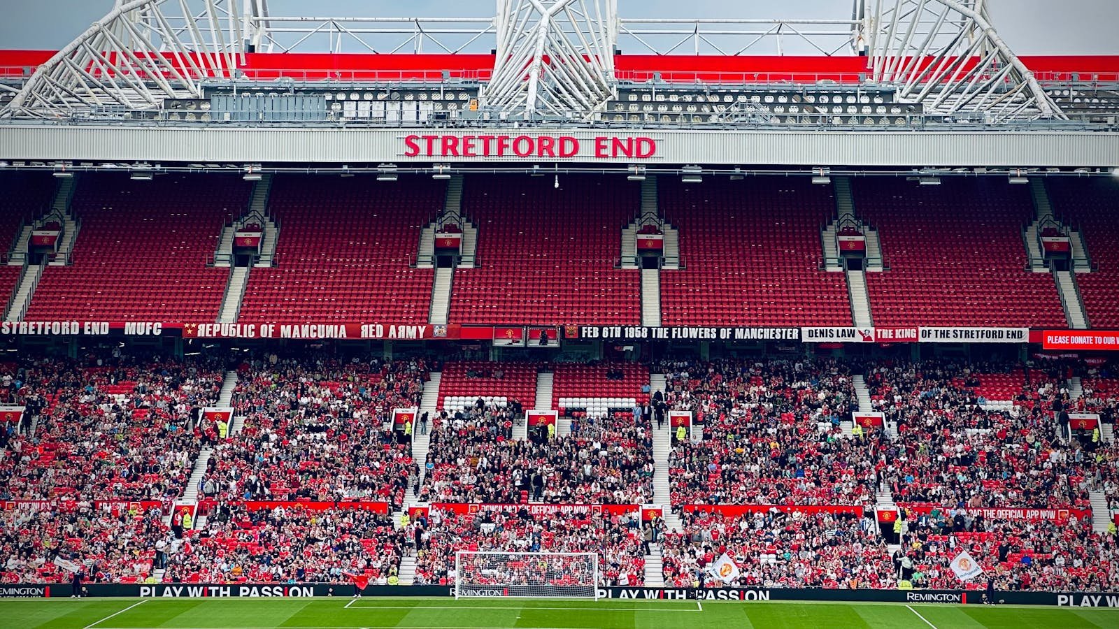 View of the Stretford End crowd at Manchester's iconic stadium during a day event.
