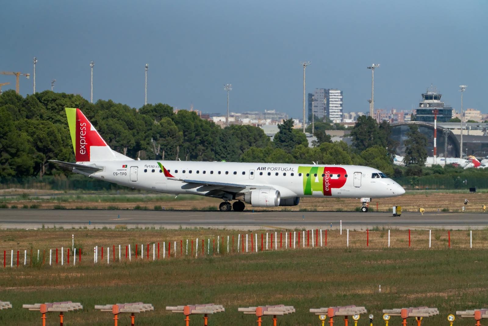 Embraer E190 airliner taxiing at Manises Airport in Valencia, Spain.